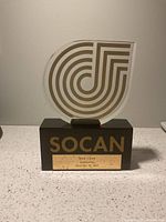 Front view showing SOCAN award with lucite emblem and base