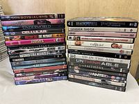 Two stacks of 31 DVD cases showing spine titles