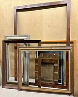 Front view showing six of the seven frames in assorted finishes and sizes