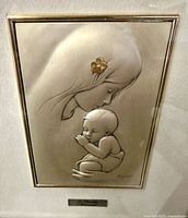 Front view of framed relief showing full artwork and frame
