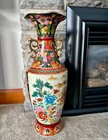 Full view of vase showing overall shape, handles, decoration