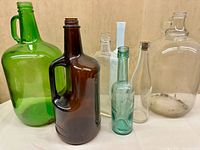 Group shot of all seven glass bottles and jugs