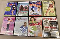 All eight DVD cases front covers visible