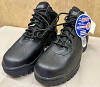 Front angled view of both boots showing uppers and tread
