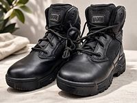 Front angled view of both boots showing overall condition and style