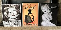 Front view of all three Marilyn Monroe tin signs