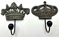 Front view of both crown wall hooks showing overall design and black finials