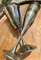 Both brass goblets crossed, showing overall forms and finish