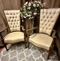 Pair of cream upholstered high-back wood armchairs