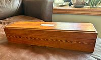 Full view of wooden presentation box closed