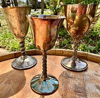 Front view of all three goblets showing form, patina and monograms