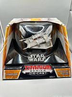 Front view of boxed Snowspeeder showing model, Star Wars and Titanium Series branding