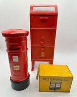 All three mailbox coin banks grouped