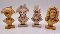 Front view of all four busts showing subjects and bases