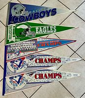 All five pennants stacked to show designs and quantity