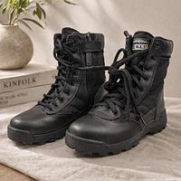 Three-quarter view of both boots showing side zip, lace system, overall condition