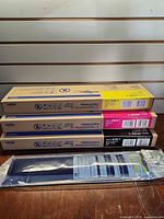 Stacked three Brother Innobella ink cartons and one sealed pouch