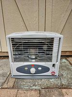 Front view showing overall heater, guard, controls, and logo