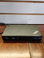 Front view showing Lenovo branding, two USB 3.0 ports, power button