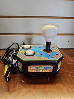 Front view of Ms. Pac-Man plug-and-play joystick with cable