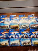 Group shot of eight sealed Hot Wheels cars on blue cards