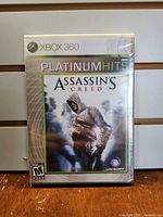 Front of sealed Xbox 360 Assassin's Creed Platinum Hits game case