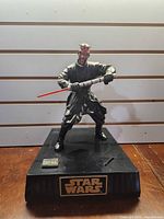 Front view of Darth Maul interactive piggy bank on base