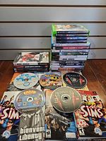 Full lot view showing stacks of cases, loose discs and manuals