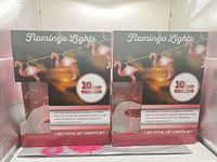 Front view of two unopened Flamingo Lights boxes