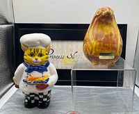 Front view chef cat and penguin on display