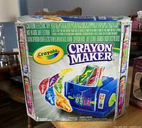 Retail box front and sides showing Crayola Crayon Maker graphics