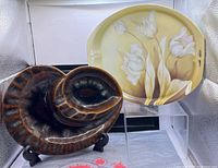 Both items side by side on display stand