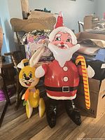 Santa and Bunny inflatable figures side by side