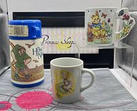 Overall lot showing both Easter mugs and Disney thermos