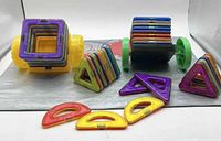 All Magformers pieces including squares, triangles, half-circles and wheel bases