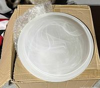 Box containing frosted glass dome light cover with bubble wrap