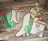 All seven NOS Taiwanese Christmas decorations in packaging on floor