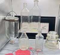 Group view of all six clear glass items