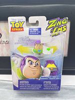 Front of sealed blister card showing Buzz Lightyear figure and package details