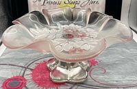 overall view of pink glass pedestal dish on display