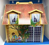 Front exterior view showing roof, windows and garden graphics