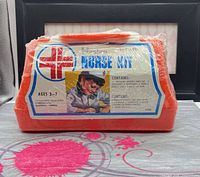 Front view of sealed orange Hasbro Nurse Kit in shrink wrap showing label details