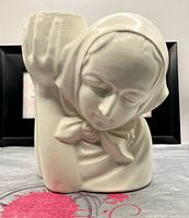 Front view of cream ceramic peasant lady planter