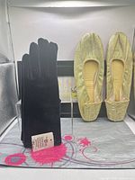 Overall view of gloves and shoes in lot