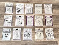 All fifteen sealed iron-on transfer envelopes laid out showing front artwork and series numbers