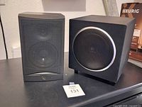 Front view of subwoofer and speaker together