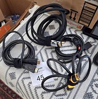 All four coiled HDMI cables on patterned surface