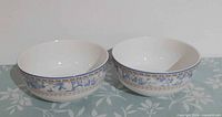 Two matching Royal Doulton Provence Bleu bowls side by side