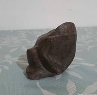 front-left view of brown stone frog sculpture