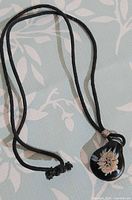 Necklace full view showing pendant and cord